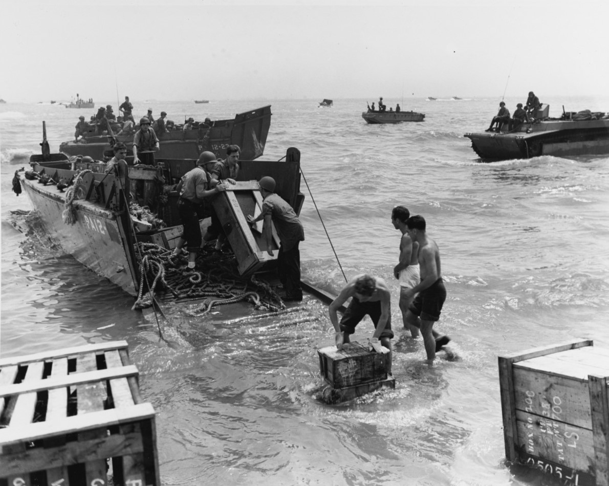 Landing craft from the Coast Guard manned Leonard Wood landing supplies in the October 1944 amphibious operations at Leyte Gulf, Philippines. (Naval History and Heritage Command) Landing craft from the Coast Guard manned Leonard Wood landing supplies in the October 1944 amphibious operations at Leyte Gulf, Philippines. (Naval History and Heritage Command)